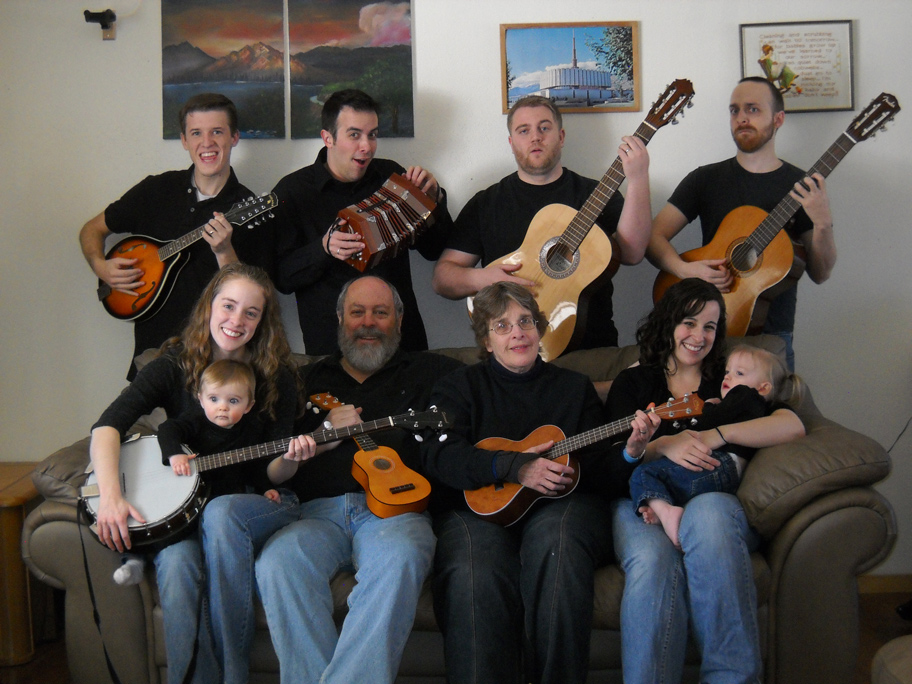 Family photo with everyone holding musical instruments